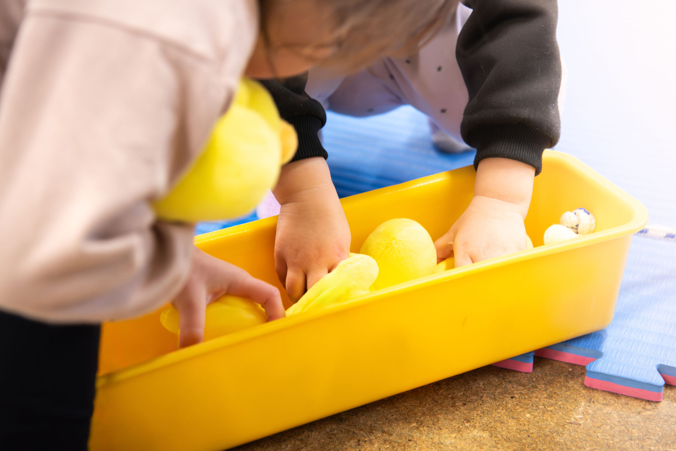toddlers choosing ducks at toddler sense class