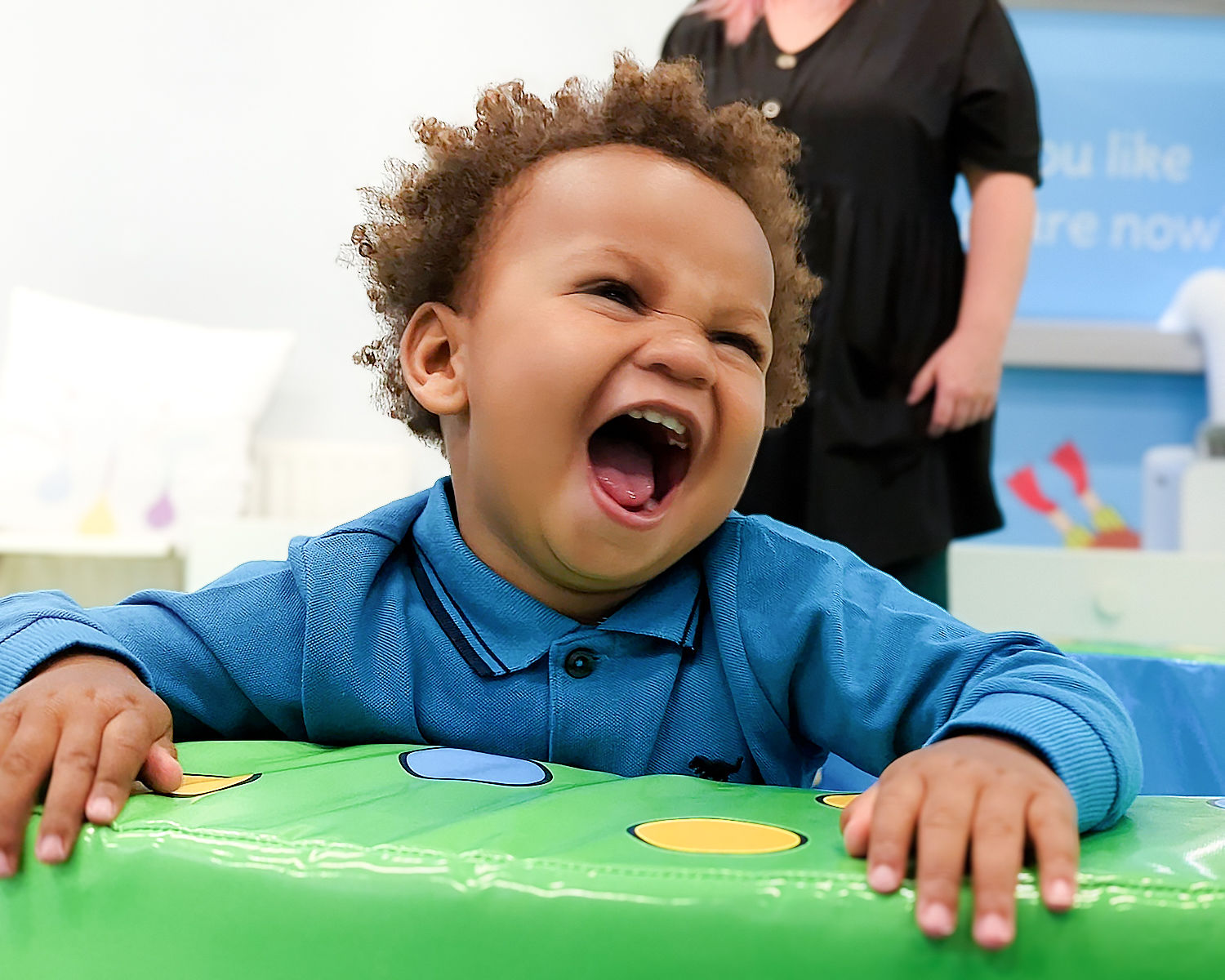 Toddler in ball pit at toddler sense class